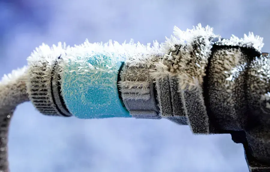 Frost built up on a wrapped outdoor pipe during a St. Louis County cold snap